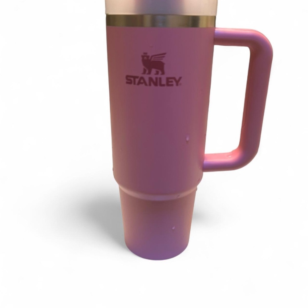 Pink Stanley 30 oz stainless steel travel mug.